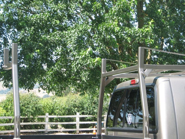 Close-up of brushed aluminum rack uprights and crossbar